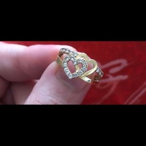 10k gold ring with diamonds around the hearts